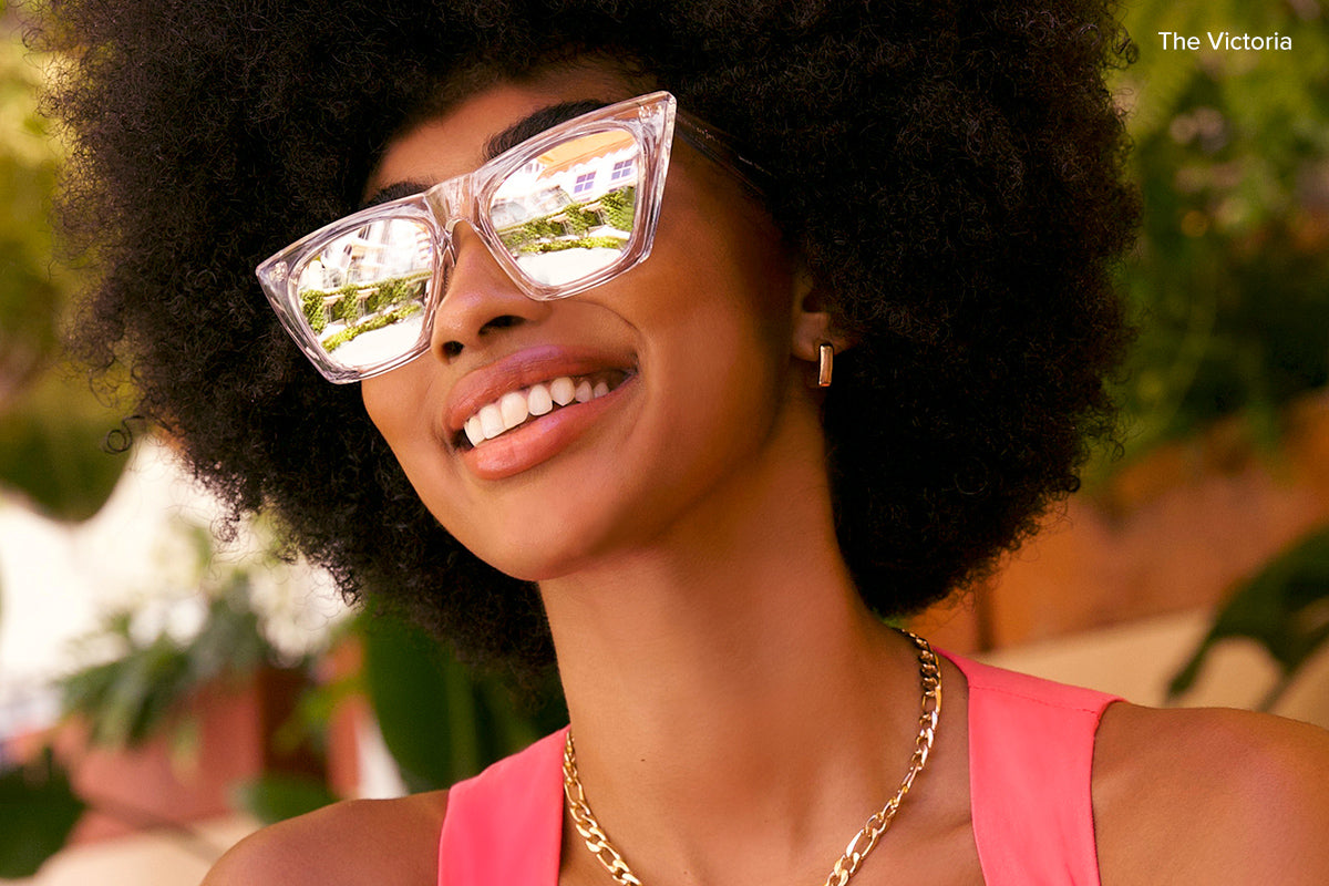 woman wearing 90s style cat eye sunglasses