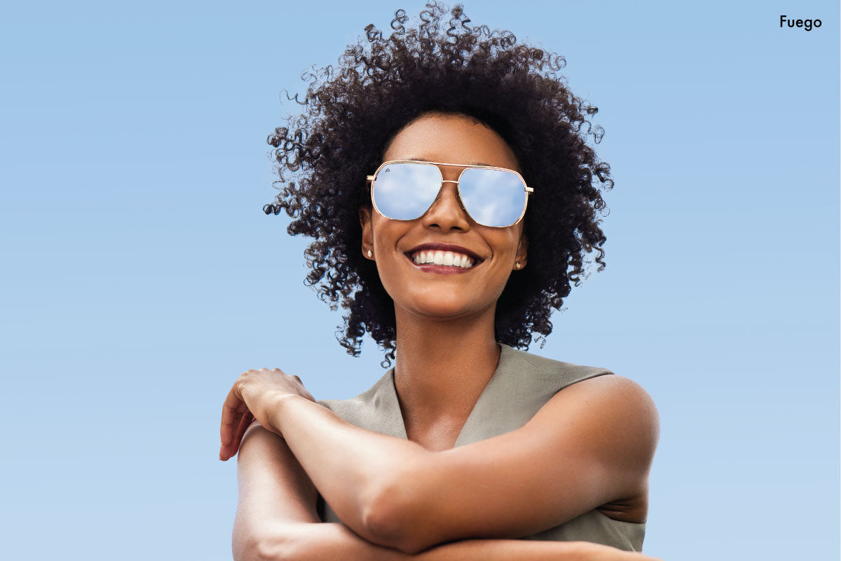 woman wearing 90s style mirror sunglasses