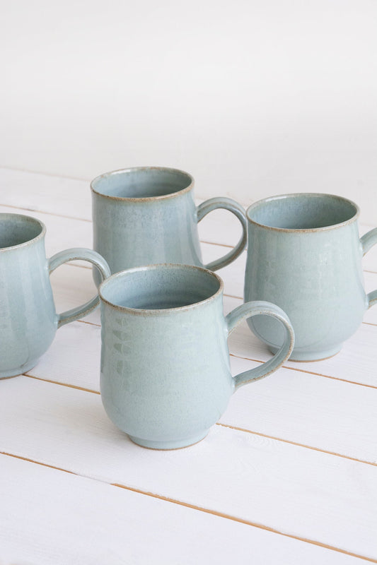 https://cdn.shopify.com/s/files/1/0017/8048/2163/products/set-of-6-pottery-coffee-mugs-in-light-blue-steel-10-fl-oz-584738.jpg?v=1669516032&width=533
