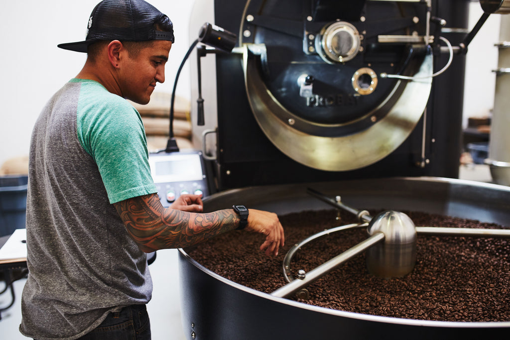 a man roasting coffee