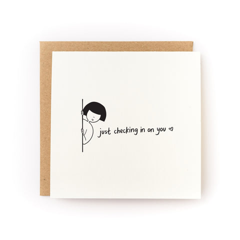 Encouraging greeting card that says, "Just Checking in On You" with a black and white illustration of a figure peeking out