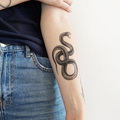 a hundred years then  Crowleys snake tattoo