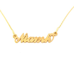 A gold plated name necklace with the Irish name Niamh in cursive letters