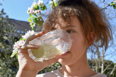 kids drinking a green protein shake