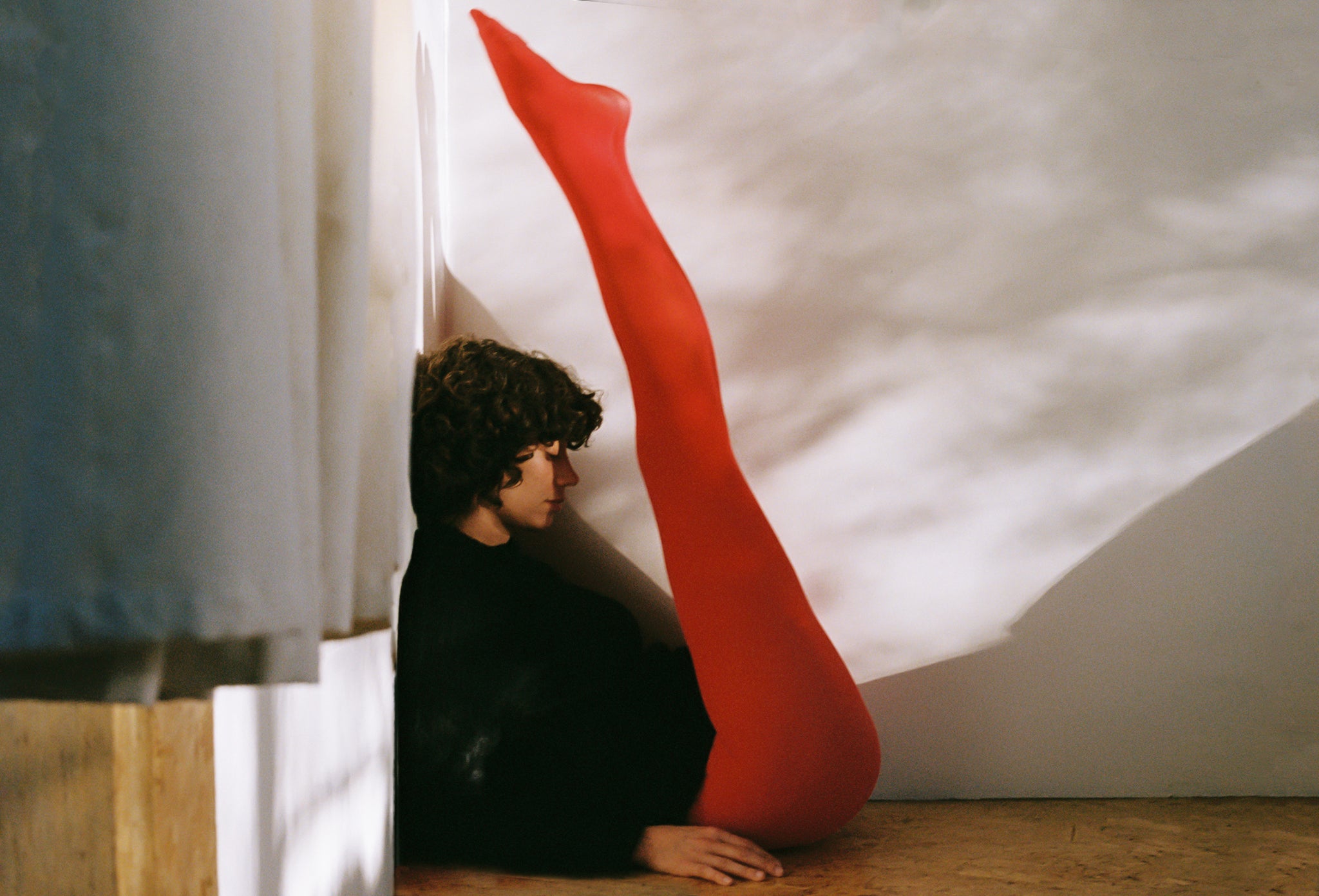 Maria Stanley sustainable designer best red tights black sweater alpaca