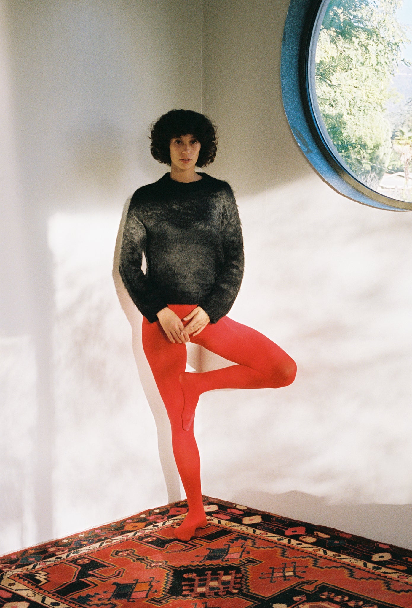 Maria Stanley sustainable designer best red tights black sweater alpaca