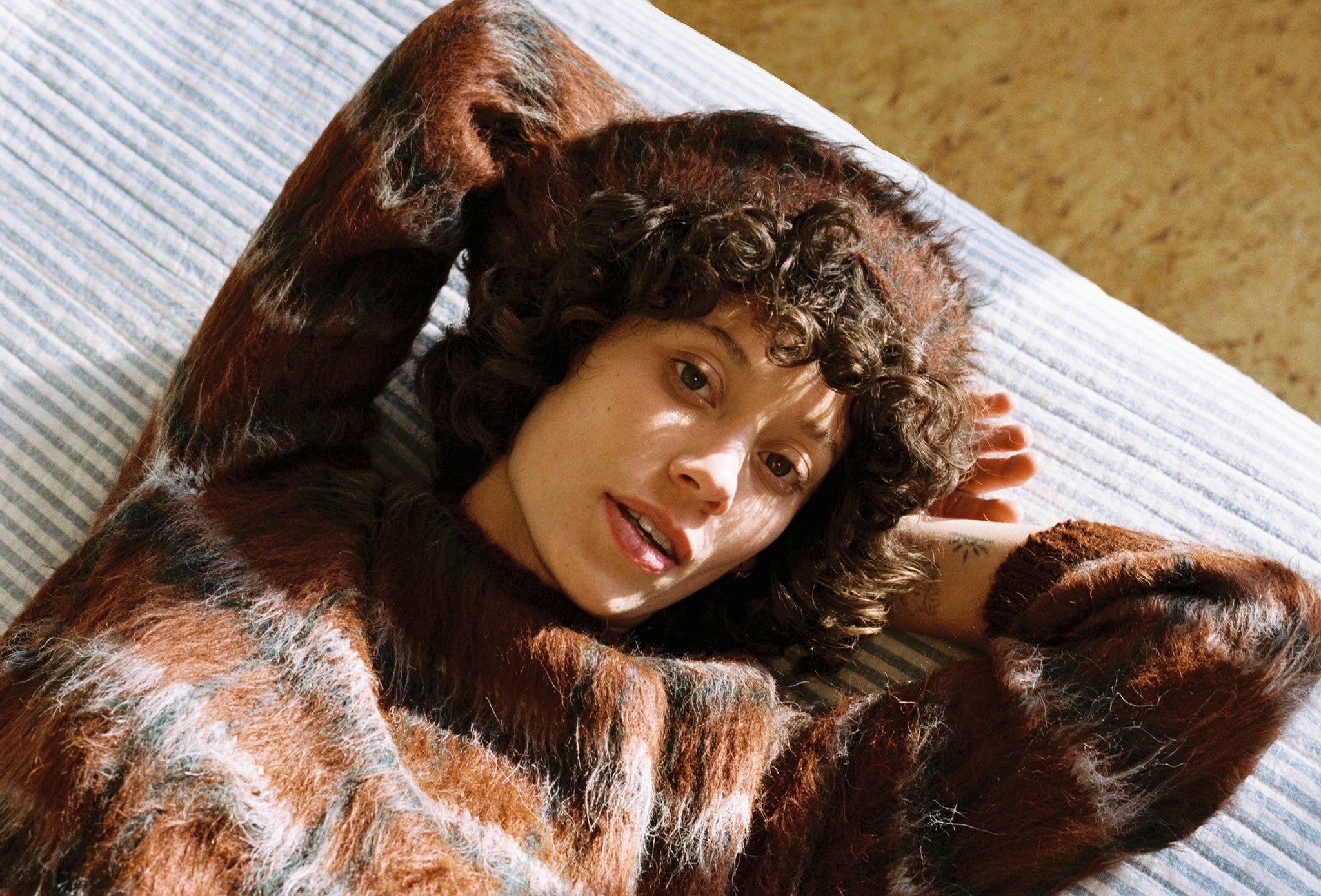 Maria Stanley best women sustainable designer Minneapolis furry plaid sweater