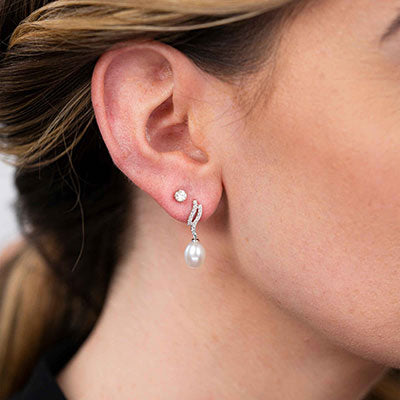 model with pearl earrings