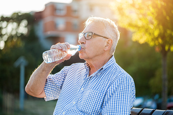 Man drinking water from a bottle