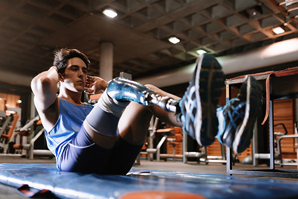 Man doing crunches at gym