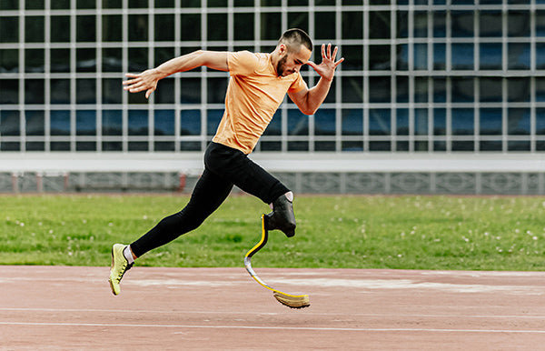 Man running with prosthesis
