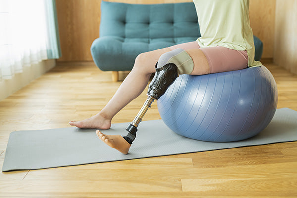 Woman sitting on exercise ball.