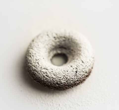 This chocolate donut sprinkled with powdered sugar was created by Logan, Utah's Num Gourmet Desserts. num gourmet desserts, keto friendly donut, powdered sugar donut, diabetic friendly treat, logan utah desserts #NumGourmetDessrts #LoganUtah #LoganUtahDessert #KetoDessert #KetoBreakfast #KetoSweets #DiabeticFriendlyDesserts #KetoDiet #GuiltFreeDessert #HighProteinDessert