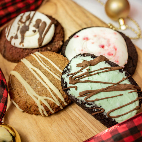 The holiday flavors box of goodies includes four cookies, red velvet, peppermint dream, gingersnap, brown butter pecan (not-pictured), and two brownies, brookie (not-pictured) and mint, from Num Gourmet, Logan, Utah. holiday keto desserts keto friendly bakeries Utah diabetic bakeries Utah Keto diet Utah #dontskipdessert #haveyourcake #ketofriendlydesserts #ketofriendlytreats #ketofriendlytreats #ketodiet #sugarfreedesserts #sugarfreecookies #sugarfreebrownies #redvelvet #gingersnap  