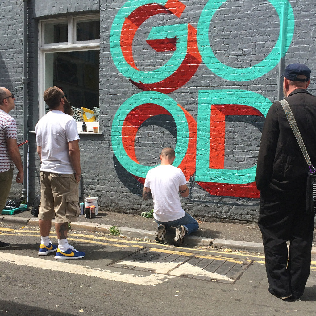 Gary Stranger painting a mural at Unlimited