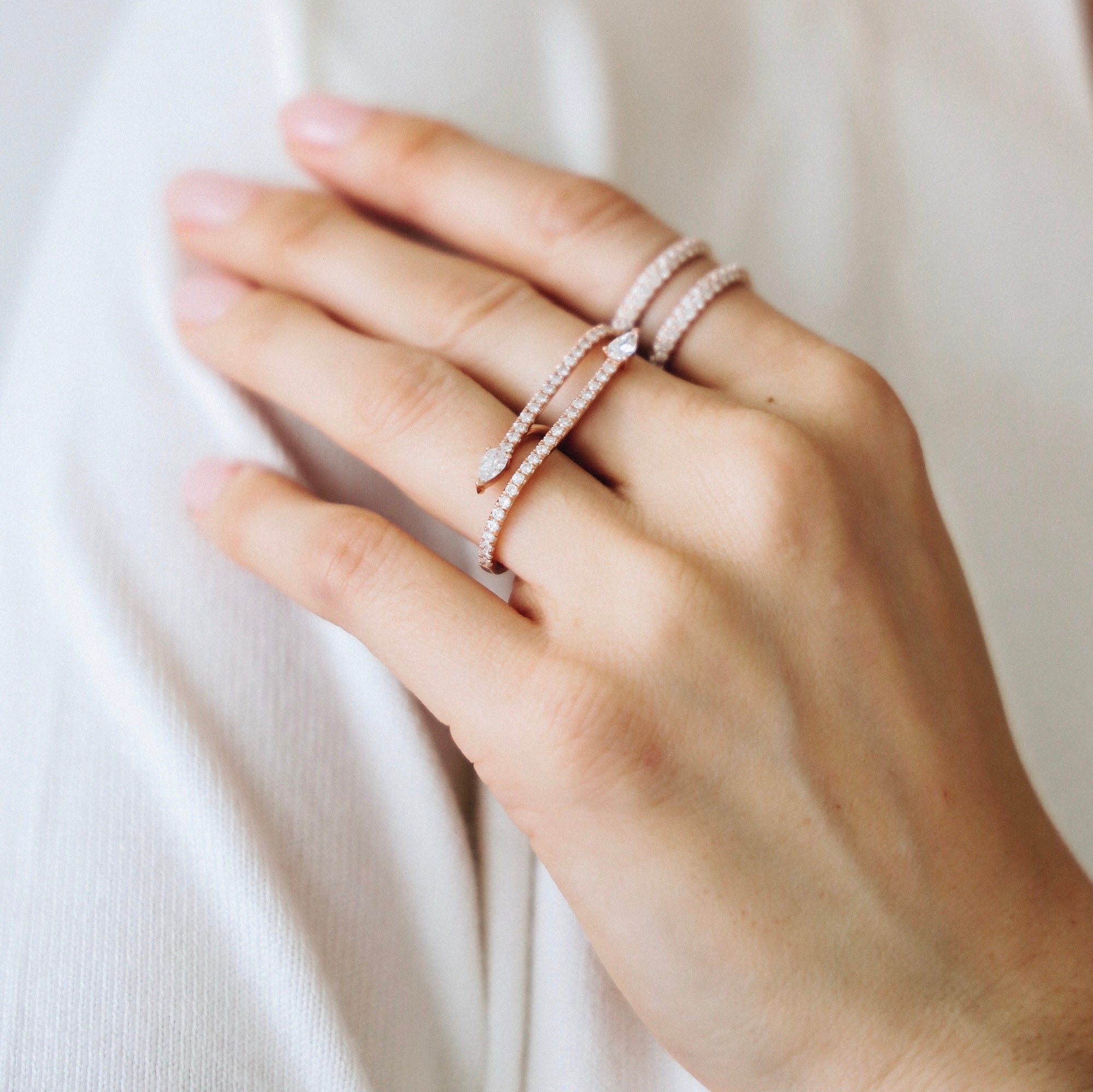 The Ditto Ring shown styled with our double fingered Neptune Ring in rose gold.