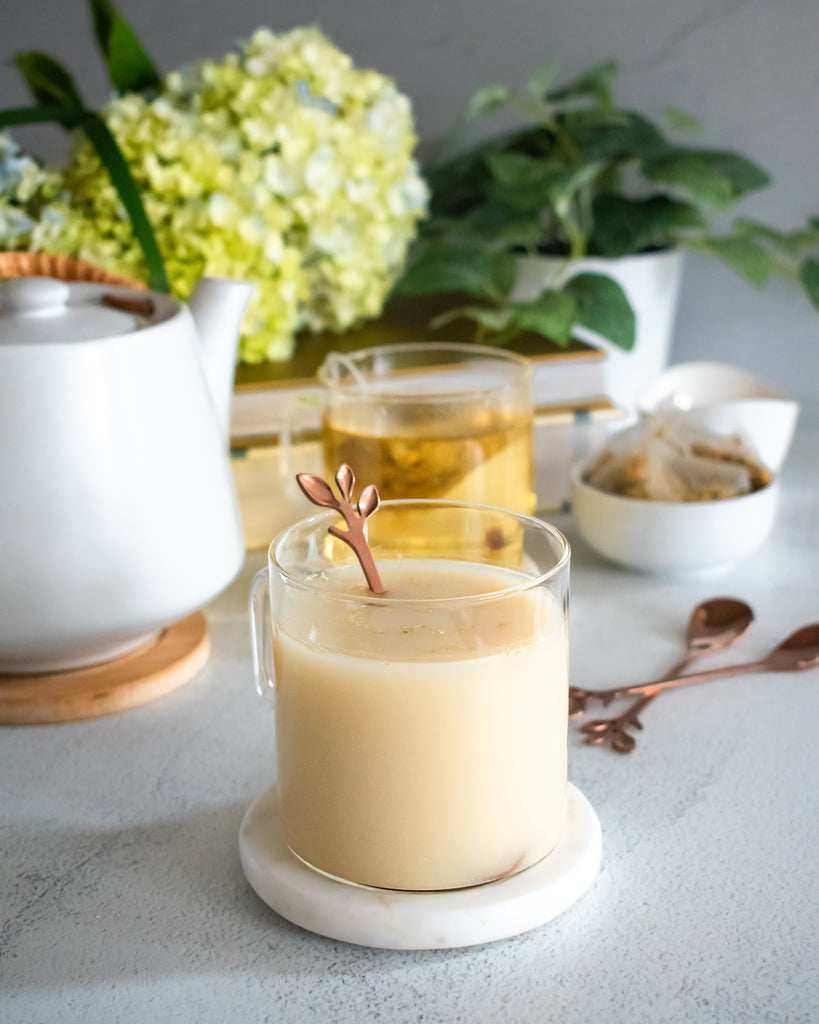glass mug of chamomile tea with milk
