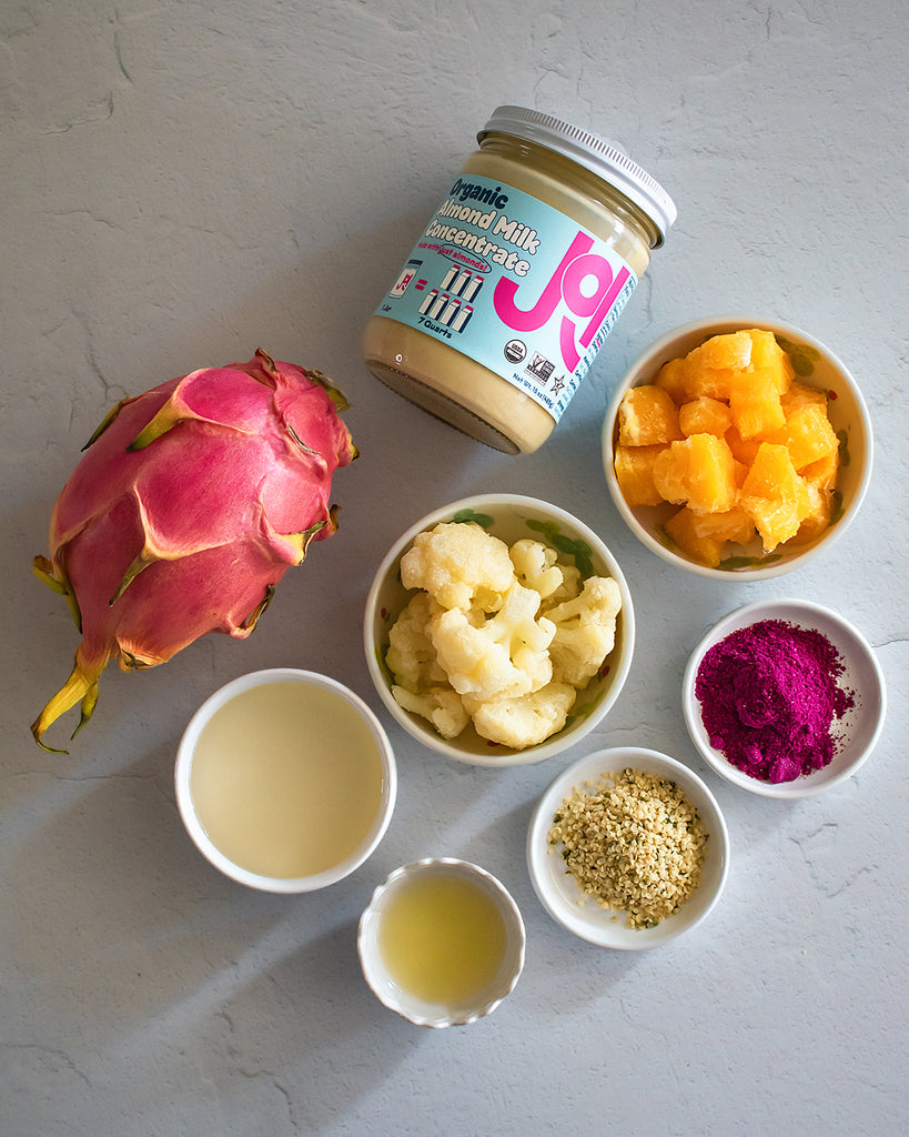 top shot of ingredients such as frozen califlower and JOI and a dragonfruit