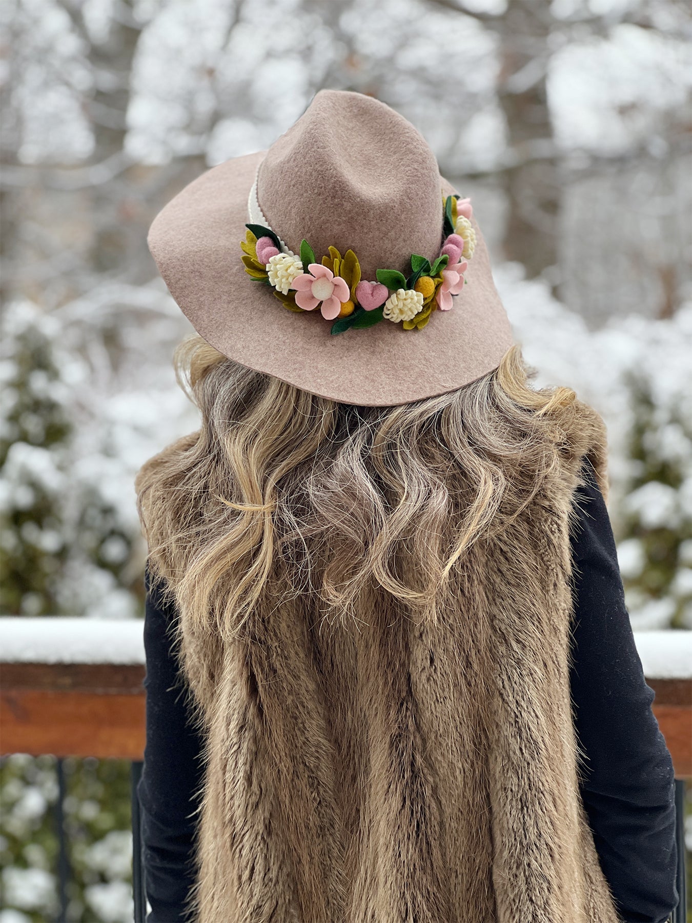 Womans felt hat with felt flowers worn outside in the winter — The Felt Store's DIY Felt Hat Band Tutorial by Lorrie Everitt of Make and Merry Co.