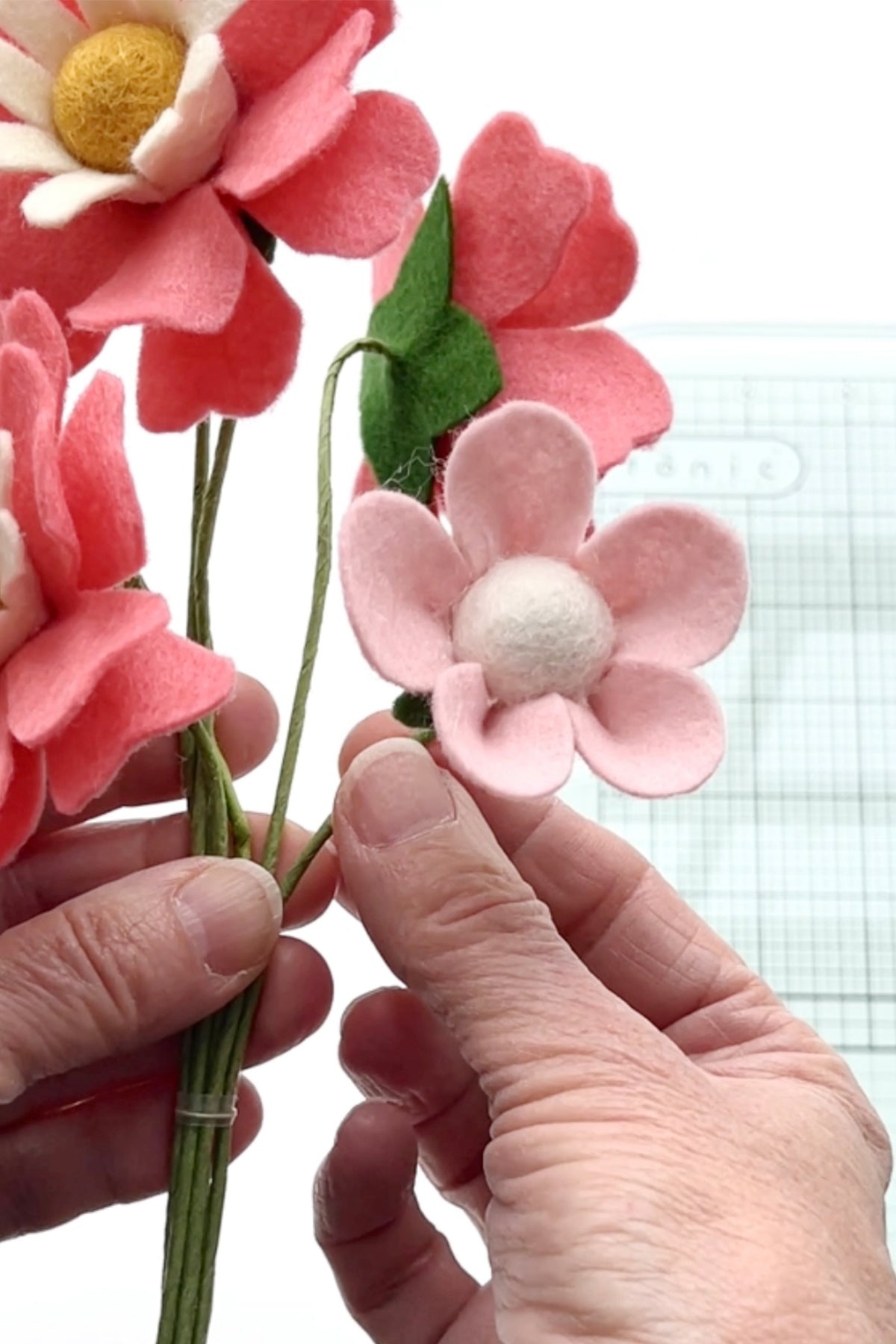 how to make a simple pink 5 petal felt flower for the felt flower bouquet wall art diy by lorrie everitt of make and merry co on the felt stores blog