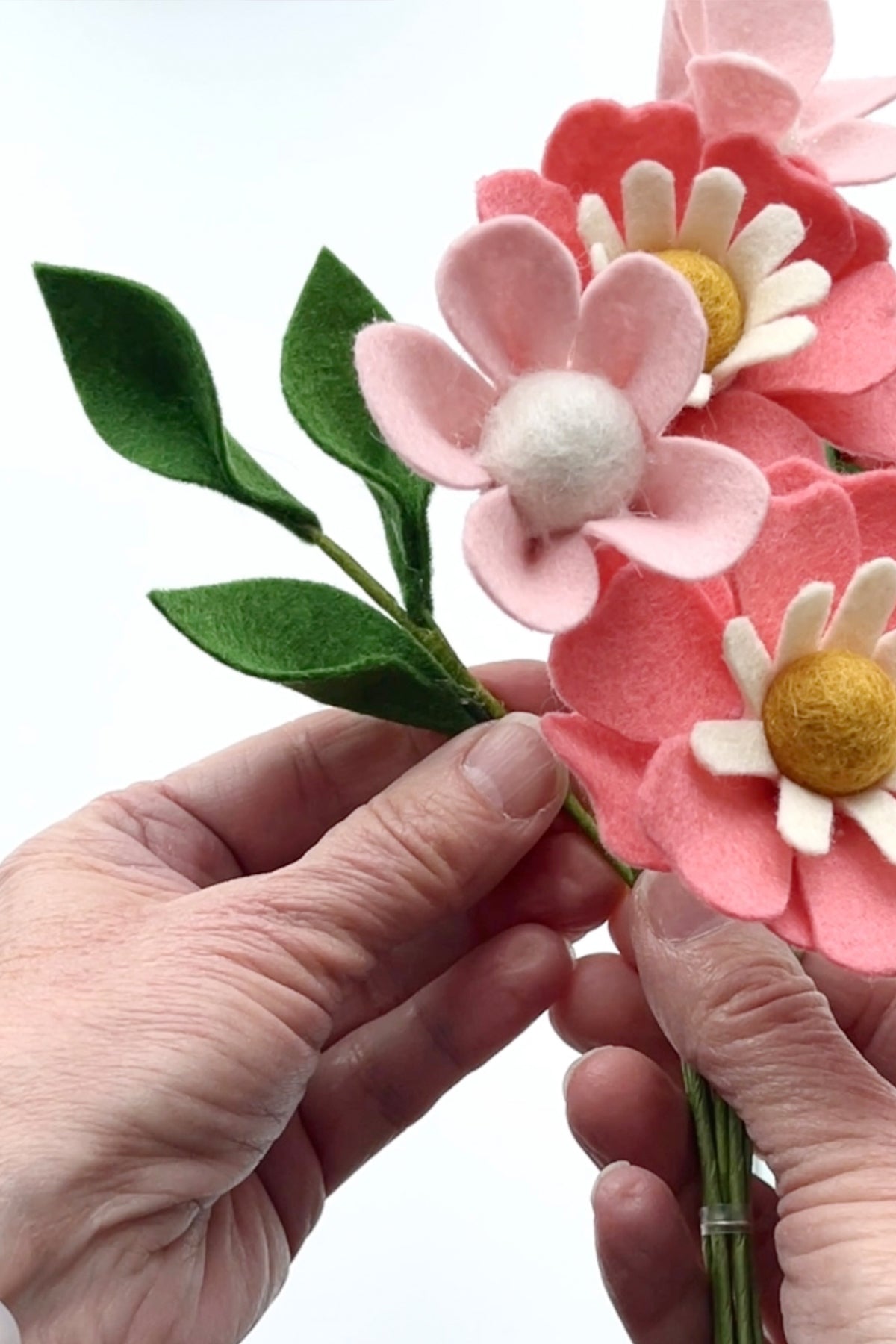 how to make a felt leafy stem for the felt flower bouquet wall art diy by lorrie everitt of make and merry co on the felt stores blog