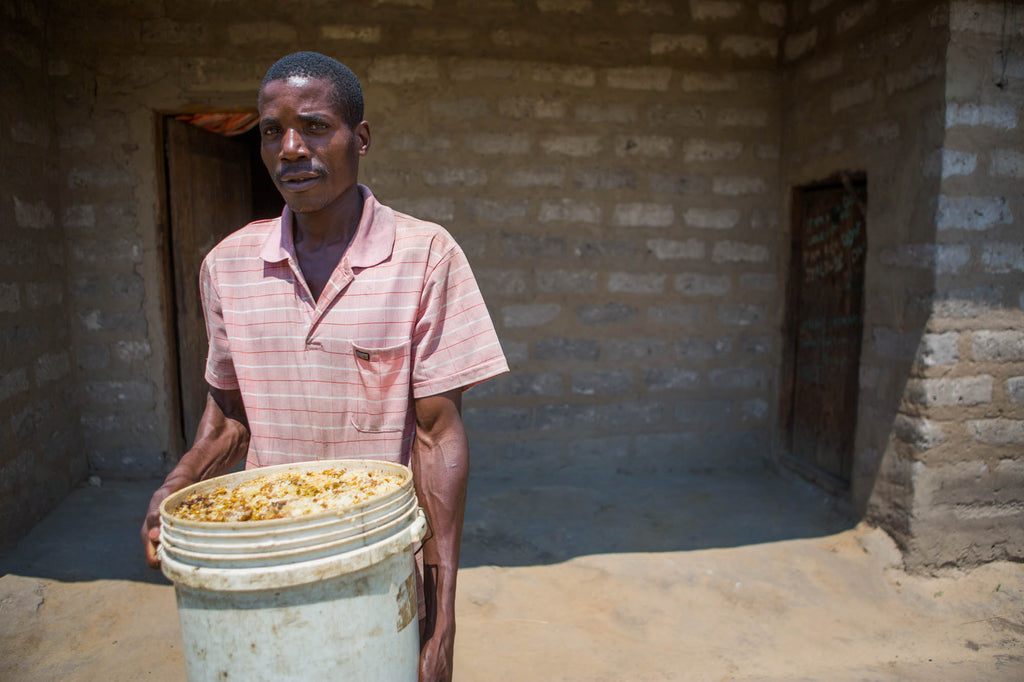 Vincent showing us one of his organic, fair trade honey and beeswax crops at his house.