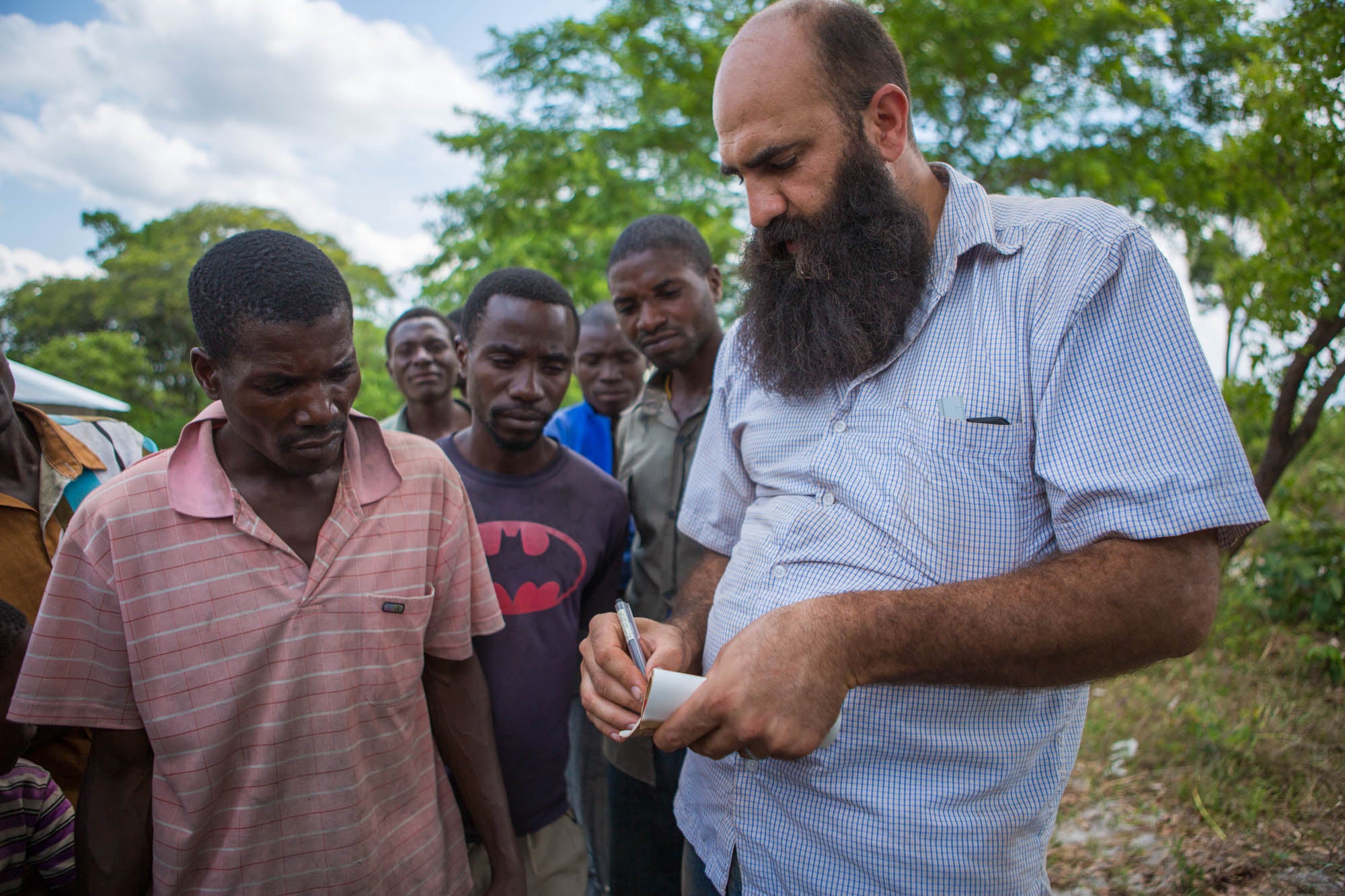 André, a Lebanese-American organic farmer from Boulder, speaking with a group of organic, fair trade Zambian beekeepers