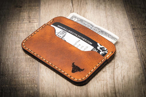 A leather card holder with multiple compartments for storage and easy handling