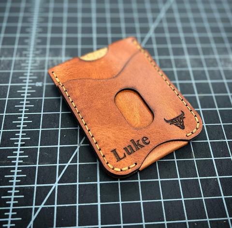 A leather card holder with monogramming and engraving options