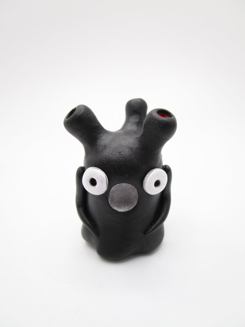 Monster black like ink with glossy eyes and tubes - misc