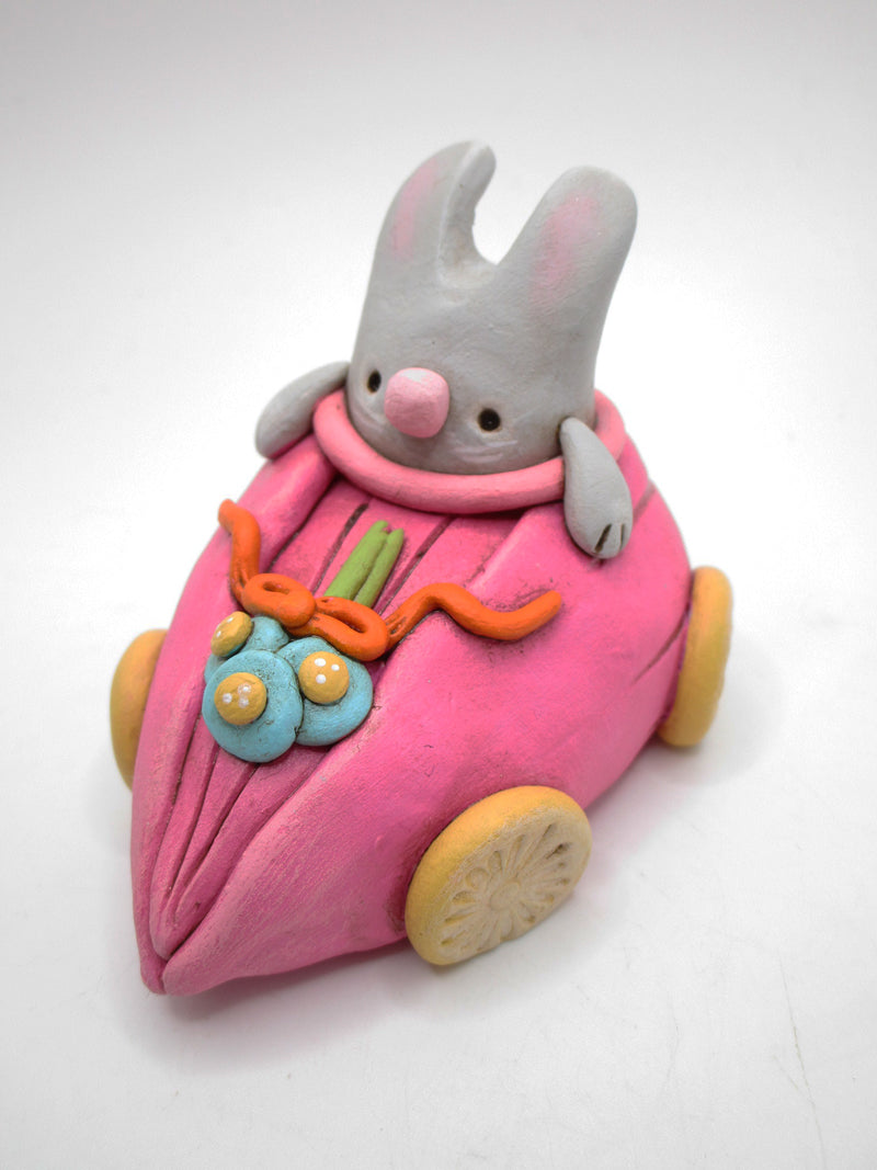 Easter Spring folk art bunny riding in pink tulip car