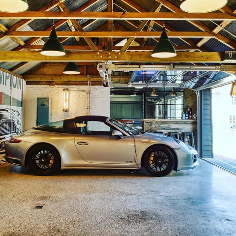 Luxury garage design with bar and vintage industrial lighting