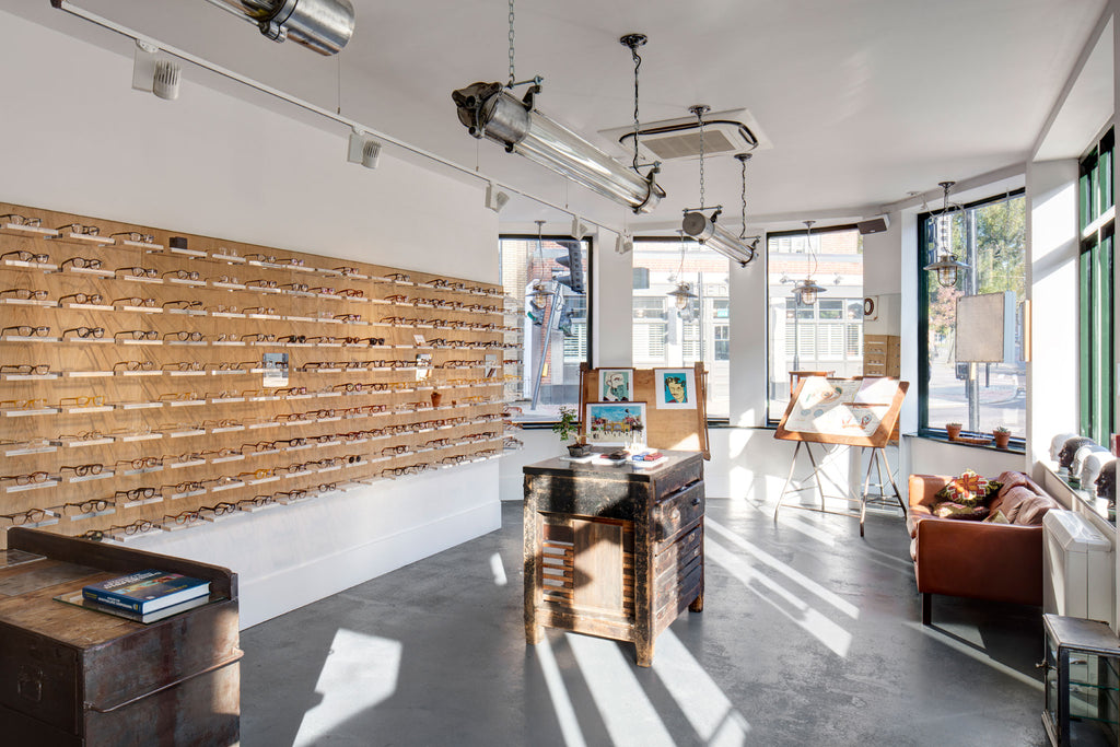 Reclaimed industrial style retail interior design with industrial aluminium & glass ceiling strip lighting