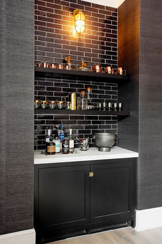 Monochrome home bar with industrial lighting