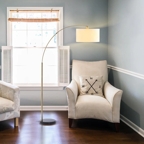 Solana Arc Floor Lamp placed next to the accent chair