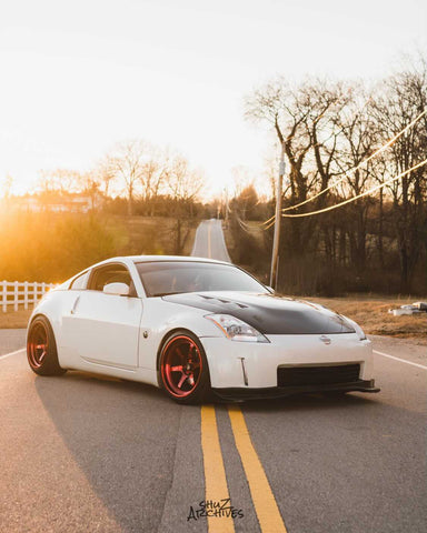 Nissan 350z z33 with Cosmis Wheels XT-006R Hyper Red 18x9.5 +10 and 18x11 +8 5x114.3