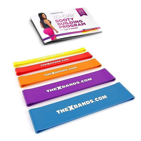 Set of five multicolored resistance bands with workout guide book