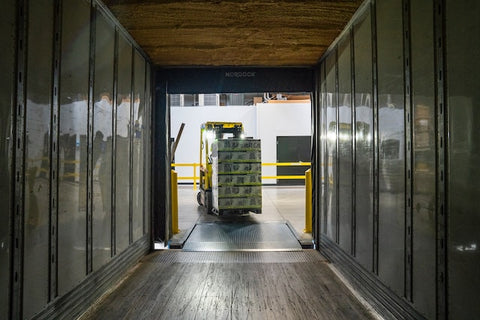 An automated lift moving materials in a warehouse 