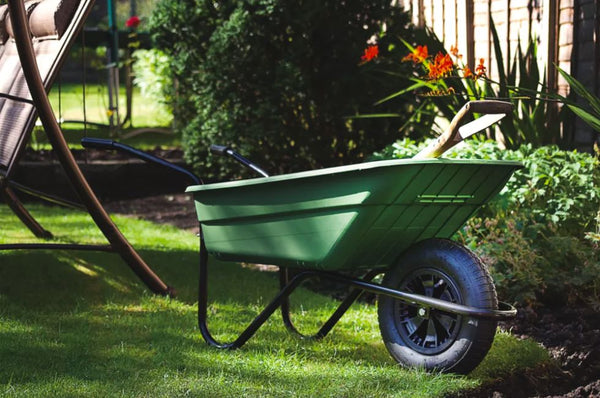 A sturdy and durable heavy-duty garden wheelbarrow designed for efficient transportation of soil, mulch, and other gardening materials.