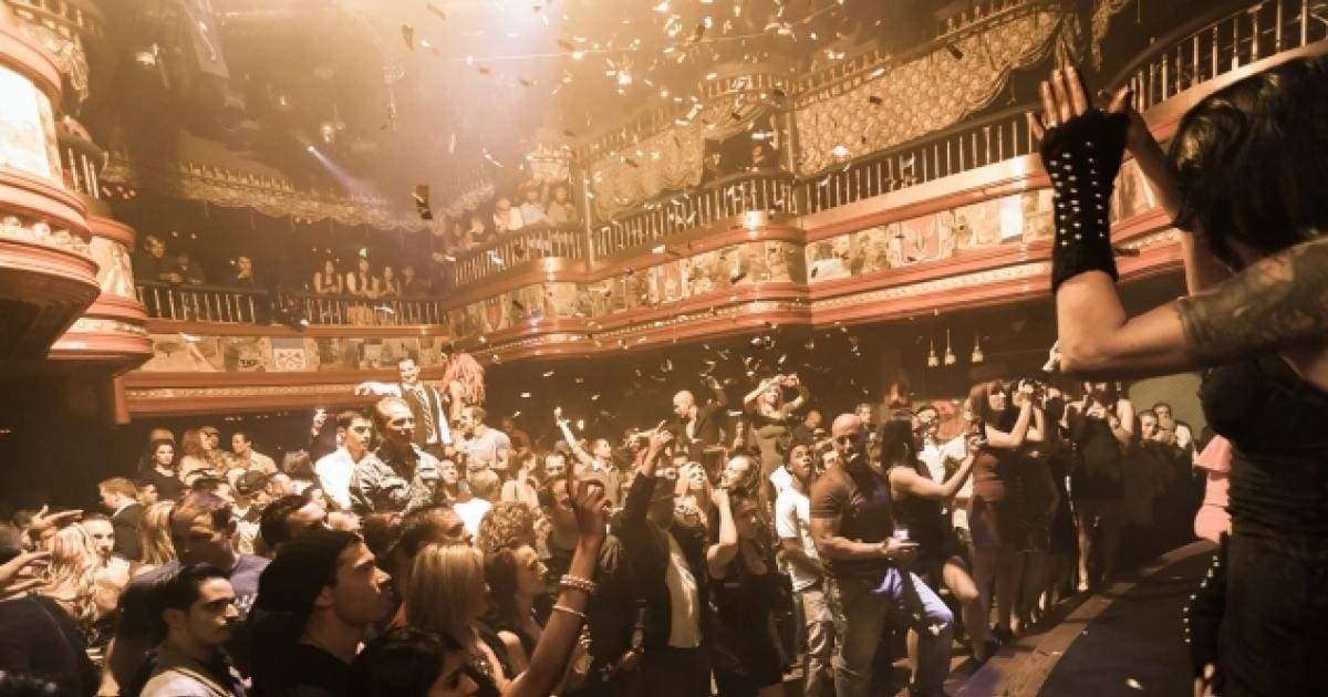 a group of people standing in front of a crowd