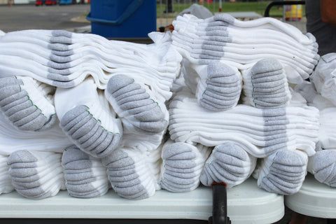 a large pile of wholesale mens crew socks