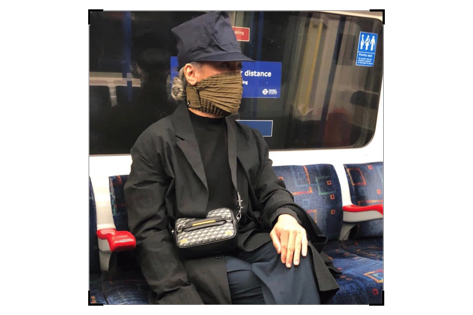 Christian in the London underground tube wearing Petit Pli Mask in Khaki Ray