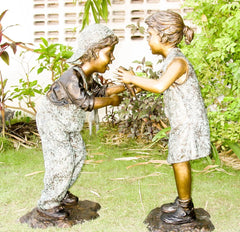 Bronze Boy and Girl Statue Sharing Ice Cream