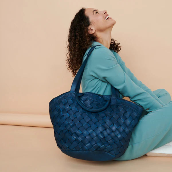woman wearing Bella tote bag