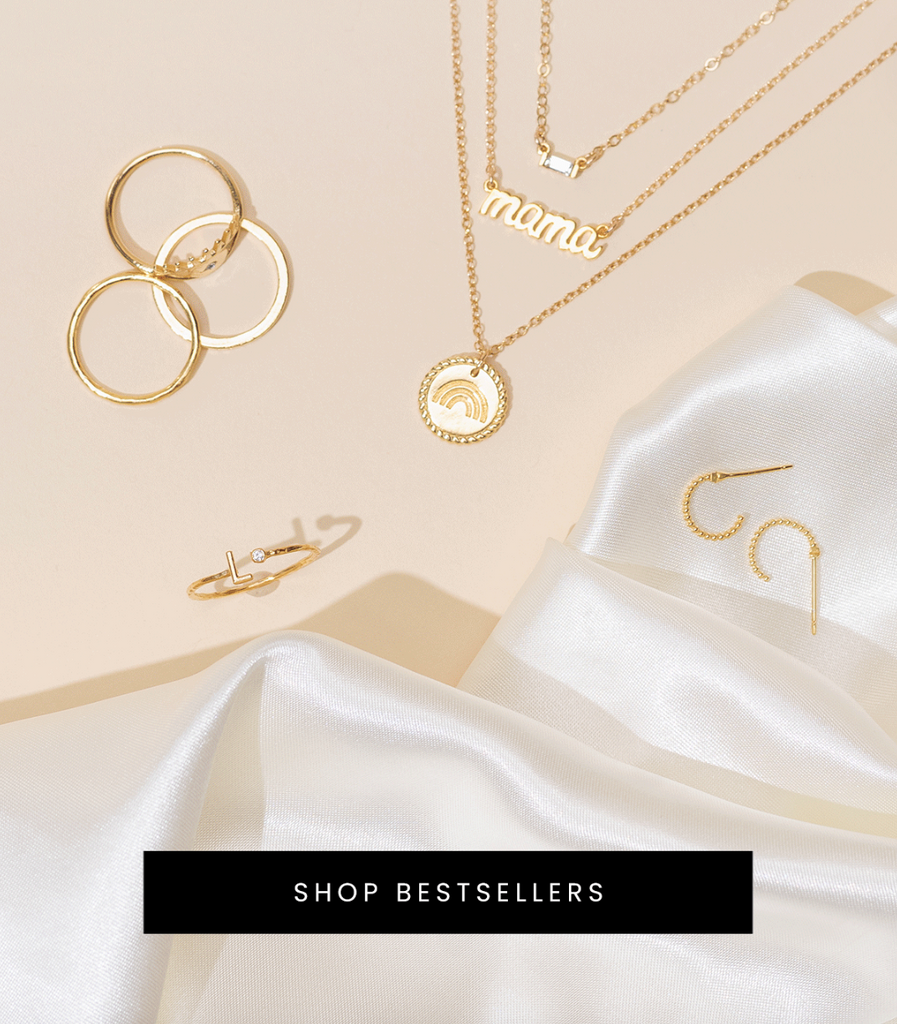 Best sellers, dainty delicate layering and stacking jewelry by Katie Dean Jewelry, handmade in America, featuring the Baguette, Mama and Rainbow Necklace _ Initial Ring and Beaded Hoops