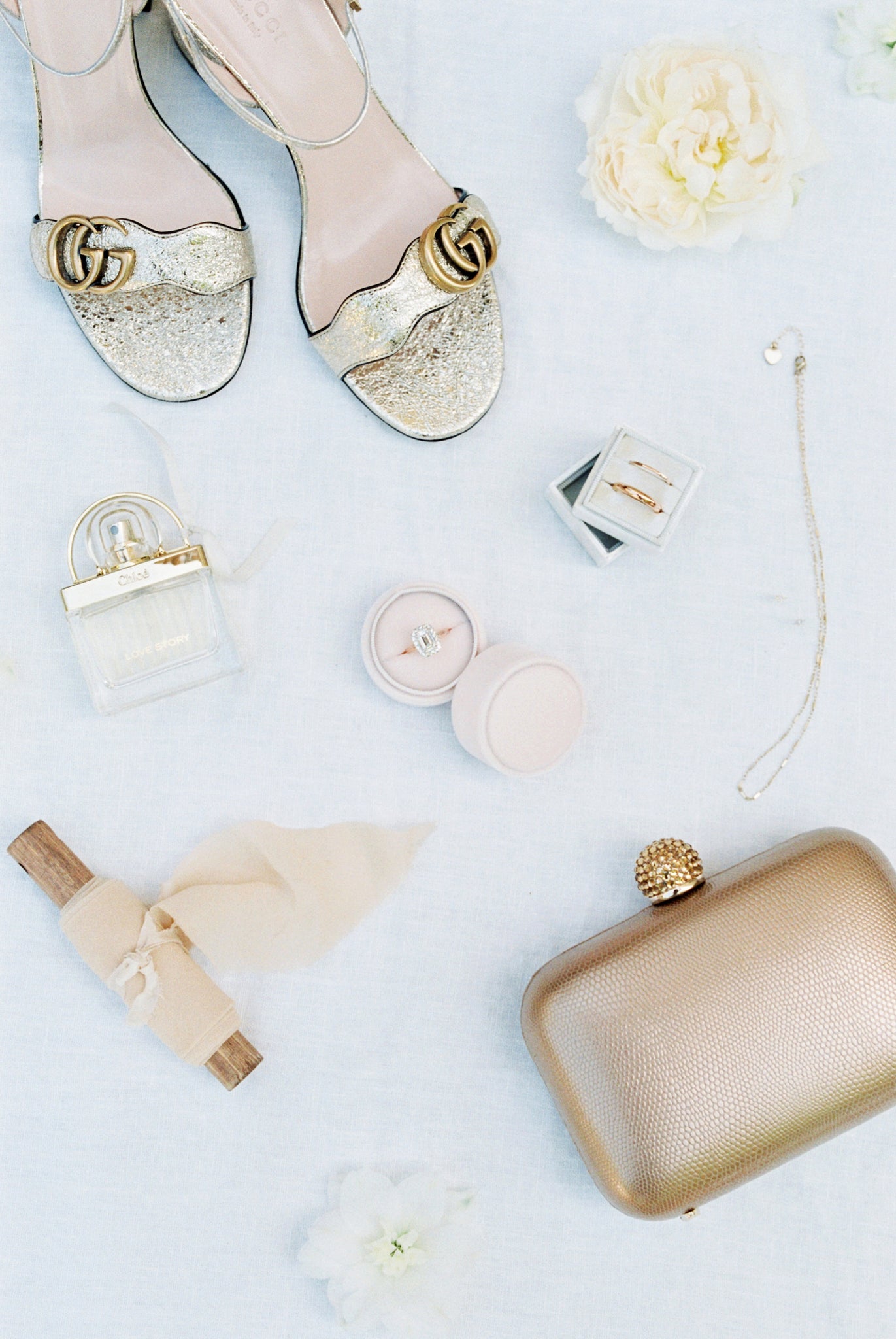 flatlay, bride shoes, jewelry, perfume, ring, purse, Katie Dean Jewelry, Provence, France Wedding, cathedral veil