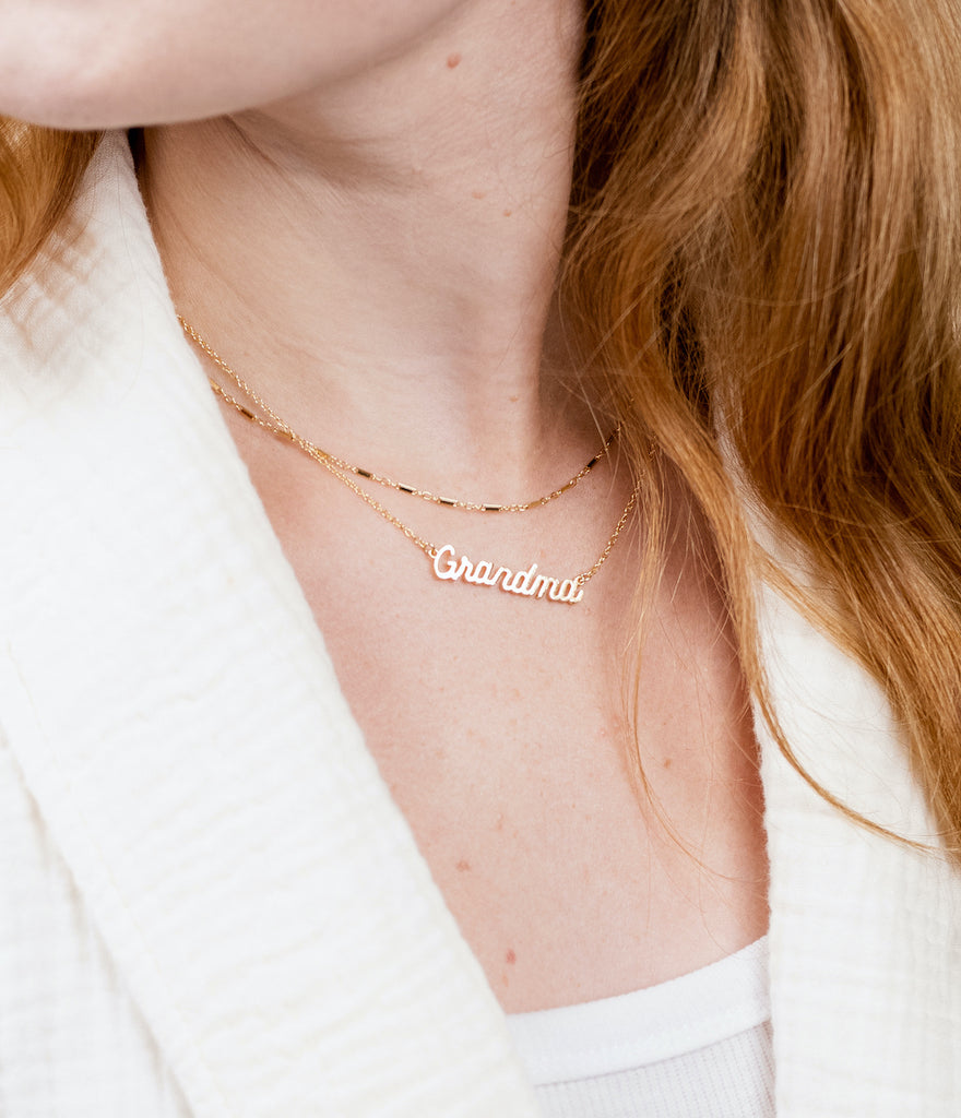 Dainty gold Grandma Necklace made in America by Katie Dean Jewelry as seen on a model