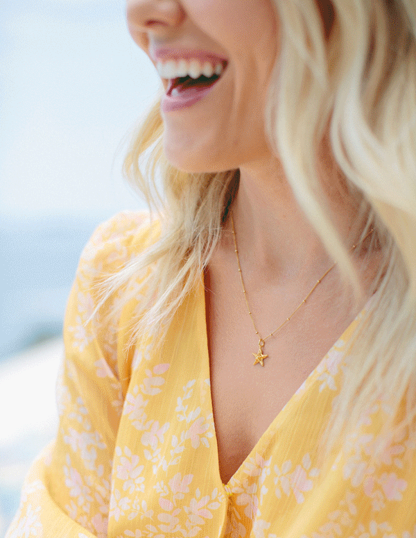 Fading .GIF of Katie Dean on a boat and then up close of her new necklace.