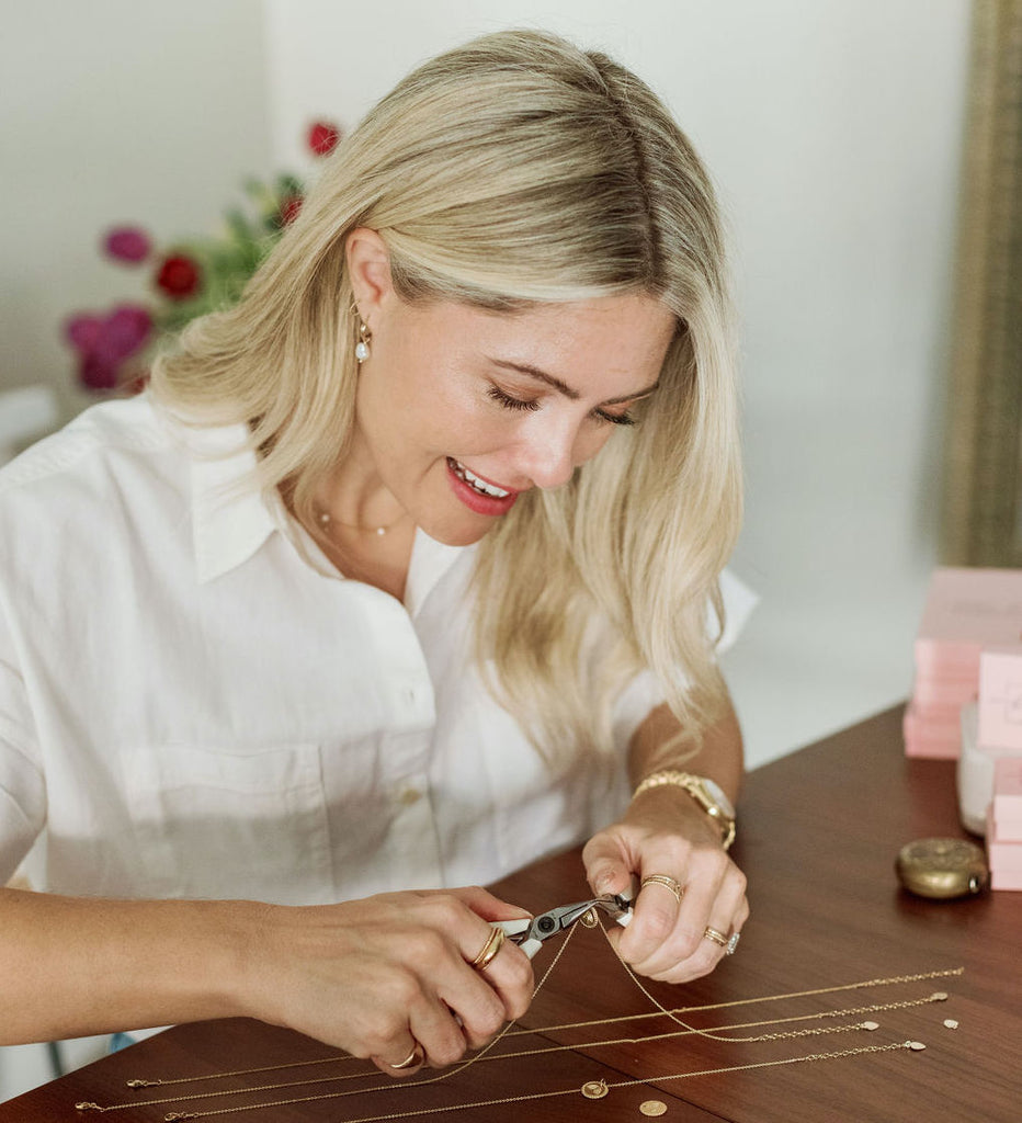 Katie Dean, founder and designer of Katie Dean Jewelry, making the rainbow necklace in her studio.