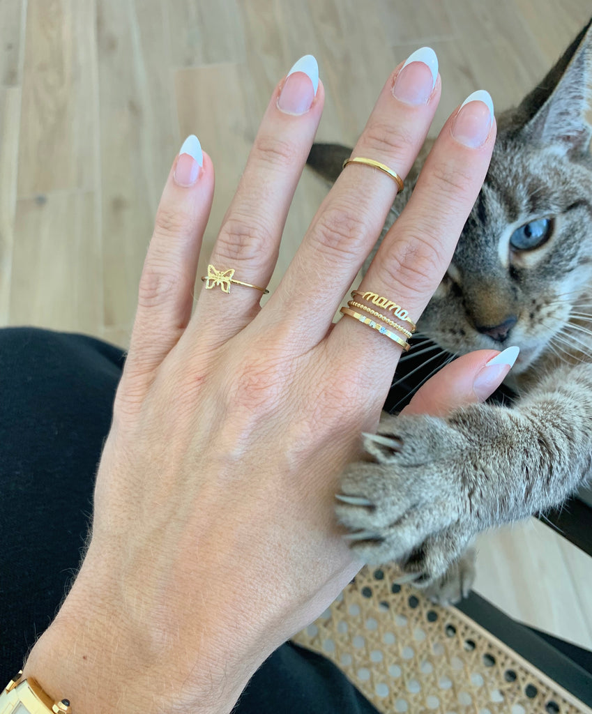 Dainty minimal ring party with the Mama Ring, Butterfly and gold stackers, made in America, with Kiki girl, our cat queen and mascot at Katie Dean Jewelry, happy international cat day!